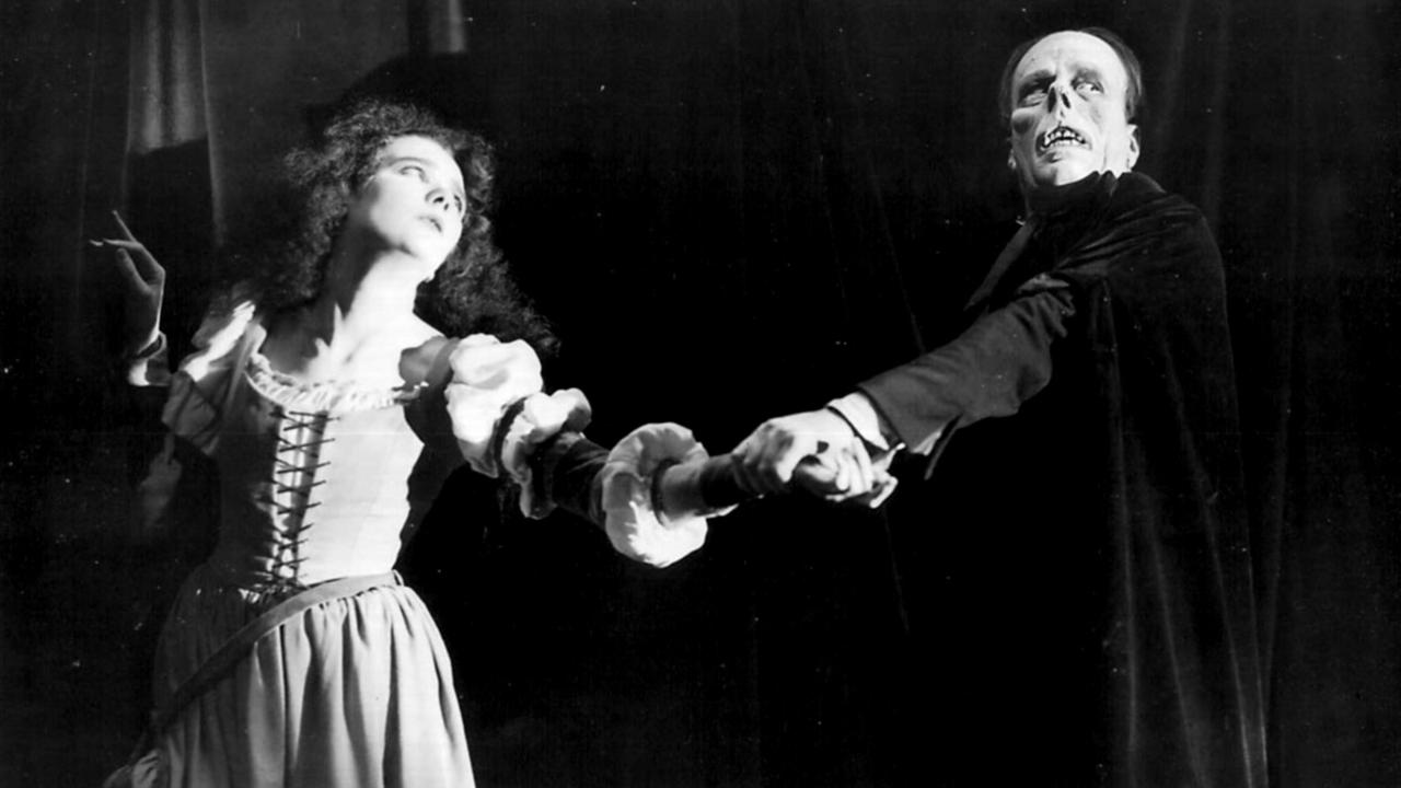 A still from phantom of the opera with its two stars
